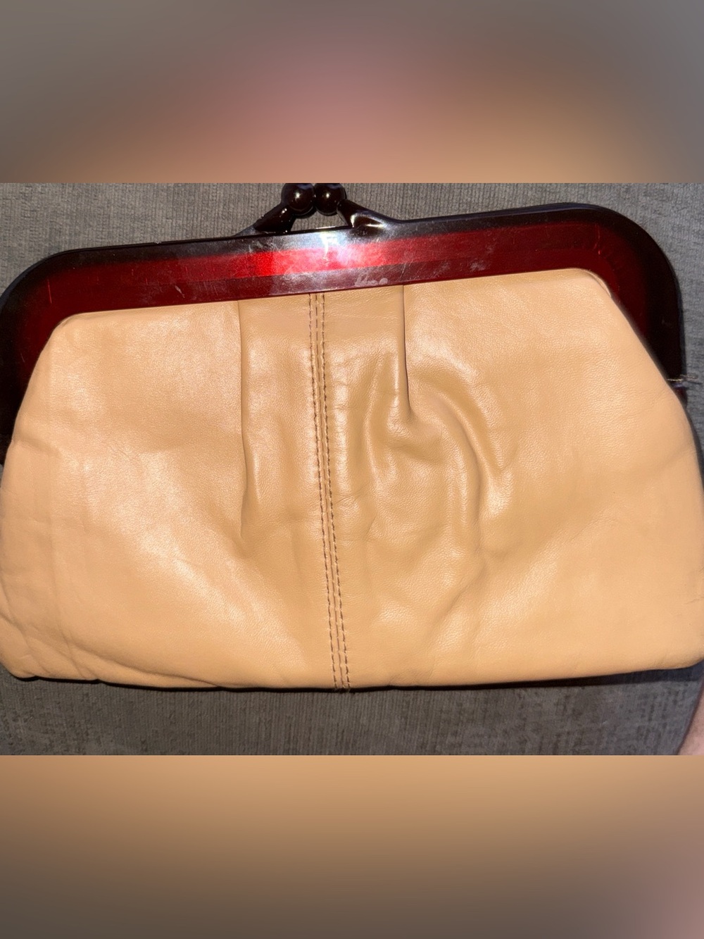 vintage tan clutch handbag featuring a tortoiseshell-style lucite framei